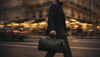 Elegant parisian man walking with his Delmas duffle bag
